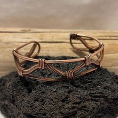 Handcrafted bracelet made with pure copper. Twisted by hand and shaped to fit your wrist. Handmade Copper Wire Cuff Bracelet Bangle, Handmade Copper Wire Cuff Bangle, Adjustable Copper Wire Bangle Bracelet, Adjustable Copper Wire Bangle, Adjustable Brown Copper Braided Bracelets, Adjustable Copper Artisan Cuff Bracelet, Adjustable Artisan Copper Cuff Bracelet, Artisan Copper Cuff Bracelet With Adjustable Fit, Artisan Adjustable Copper Cuff Bracelet