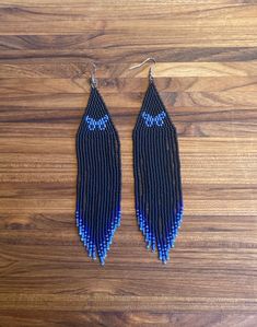 Black seed beads fringe earrings with blue butterflies, nickel free earwires. 5 inches long. Buffalo Plaid Beaded Earrings, Blue Fringe Earrings, Blue Seed Bead Earrings, Butterfly Beaded Earrings, Blue Butterfly Earrings, Black Beaded Earrings, Fringe Beaded Earrings, Seed Bead Projects, Diy Seed Bead Earrings