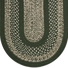 an oval rug with the letter u in green and beige colors, on a white background