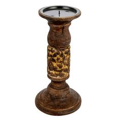 a wooden candle holder with an animal print design