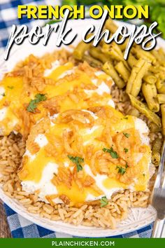 french onion pork chops with rice and green beans on a white plate next to a fork