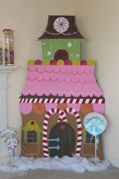 a house made out of cardboard and candy canes