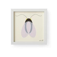 a framed insect print in white frame