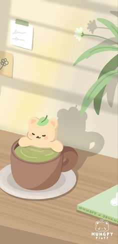 a cat sitting in a cup on top of a wooden table next to a plant