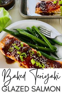 baked teriyaki glazed salmon with green beans and sesame seeds on a white plate