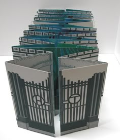 a stack of folded cards with gates on them