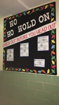 a bulletin board that says ho hod on and check out before you head out