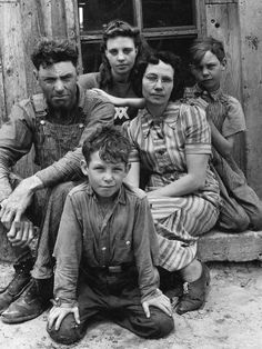 an old black and white photo of a family