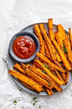 baked french fries with ketchup on a plate