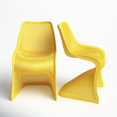 two yellow plastic chairs sitting next to each other