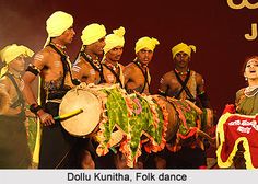 a group of people that are standing in front of a drum