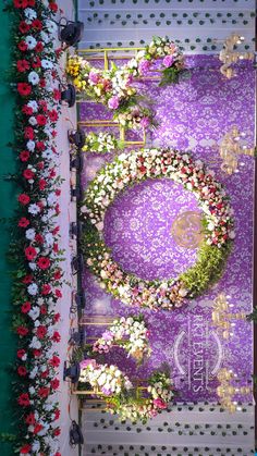 an overhead view of a purple and white floral display