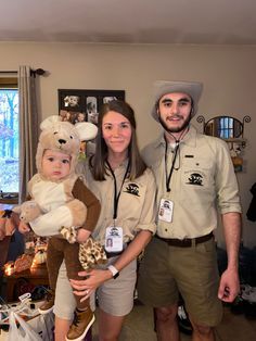 two people and a child are dressed up as teddy bears