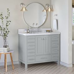 a bathroom with a sink, mirror and bathtub