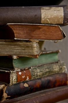 a stack of books sitting on top of a table