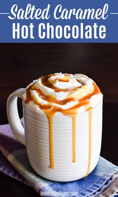 salted caramel hot chocolate in a white mug on top of a blue towel