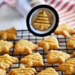 some cookies are on a cooling rack with a magnifying glass in front of them