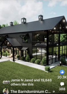 an artist's rendering of a large black barn style home in the middle of a grassy area