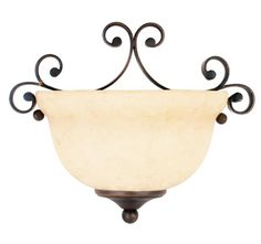 a light fixture with an ornate design on it