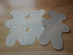 cut out teddy bears sitting on top of a wooden table