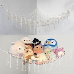 a bunch of stuffed animals that are on a string