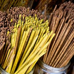 two jars filled with different types of sticks