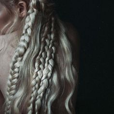 a woman with long blonde hair and braids