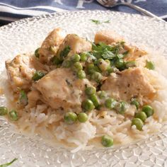 a white plate topped with rice and peas