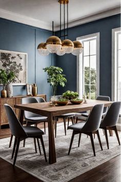 an elegant dining room with blue walls and wooden table surrounded by gray upholstered chairs