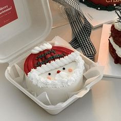 two cakes decorated like santa claus and one is red velvet with white frosting on top