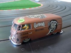 a toy van is sitting on a track