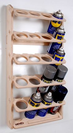 a wooden rack with cans and cans on it