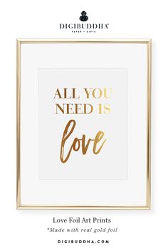 a gold foil print with the words all you need is love on it in a white frame