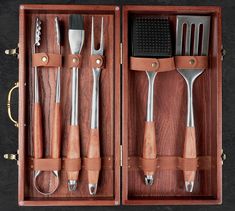 a wooden box filled with different types of utensils