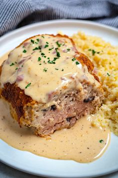 meatloaf with gravy and mashed potatoes on a plate