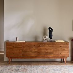 a large wooden dresser sitting on top of a hard wood floor