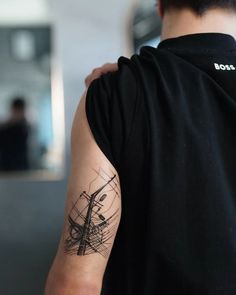 a man with a tattoo on his arm