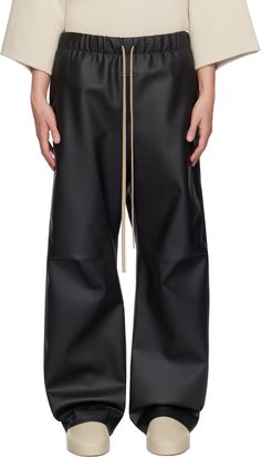 Relaxed-fit and wide-leg polyurethane-coated polyester jersey track pants. · Drawstring at elasticized waistband · Two-pocket styling · Leather logo patch at front · Pleat at knees · Press-stud tab at cuffs · Dropped inseam · Partial satin lining Supplier color: Black Wide Leg Track Pants, Wrap Pants, Fear Of God, Leather Logo, Mens Activewear, Off Black, Press Studs, Track Pants, Patch Logo