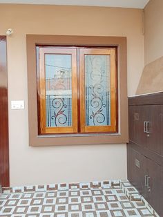 a bathroom with a tiled floor and two wooden window panes on the side of the wall