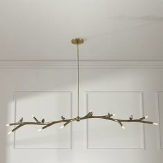 a chandelier hanging from the ceiling with birds on it