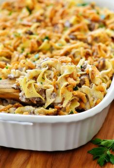 a casserole dish filled with pasta and meat