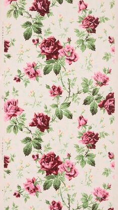 a pink and green flowered wallpaper with roses on it's back ground