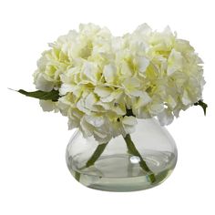 a vase filled with white flowers on top of a table