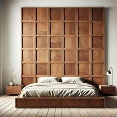 a large bed with wooden headboard and pillows in a room that has hardwood floors