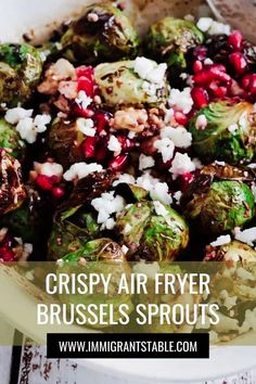 brussel sprouts with onions and pomegranate in a bowl