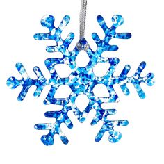 a blue snowflake ornament on a white background