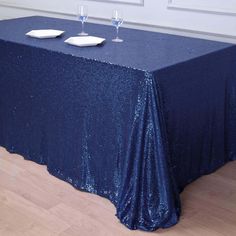 a blue table cloth with two glasses on it