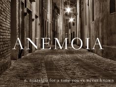 an empty alley with the words anemola in white and black on it's right side