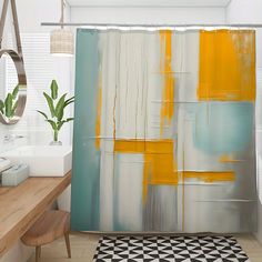 a bathroom with a shower curtain that has an abstract painting on it