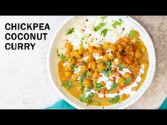 chickpea coconut curry in a bowl with rice and cilantro